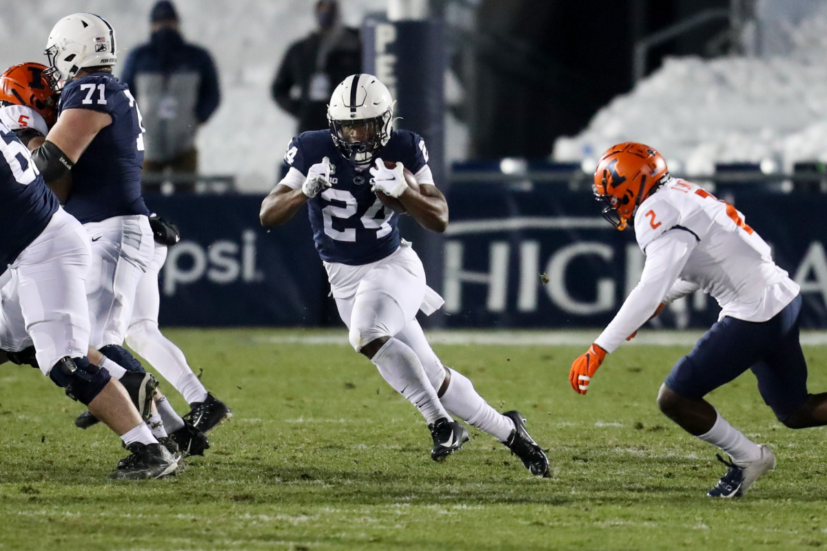 Dec 19, 2020; University Park, Pennsylvania, USA; Penn State Nittany Lions running back Keyvone Lee (24) runs with the ball during the first quarter against the Illinois Fighting Illini at Beaver Stadium. Penn State defeated Illinois 56-21. Mandatory Credit: Matthew OHaren-USA TODAY Sports