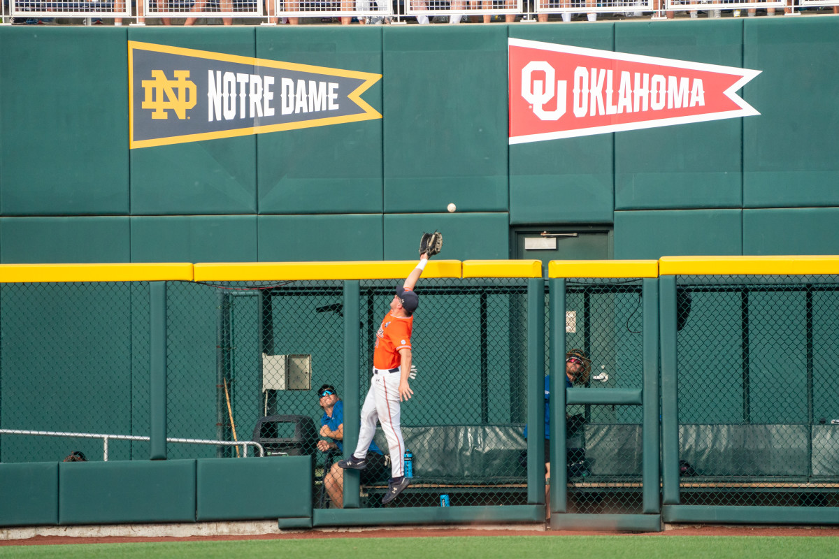 Auburn outfielder Mike Bello (31) runs to first during an NCAA