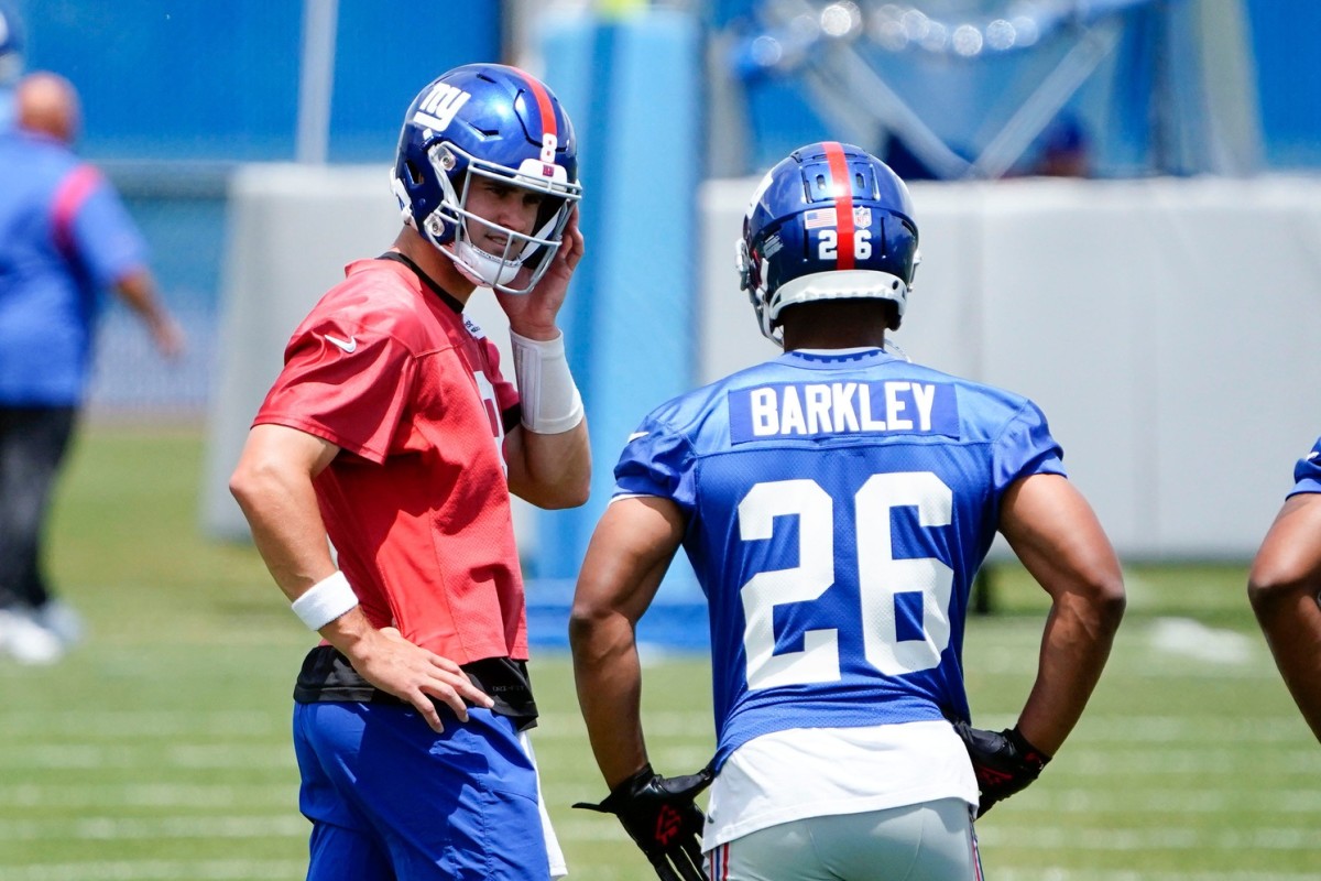 New York Giants quarterback Daniel Jones (8) and running back Saquon Barkley (26) on the field for mandatory minicamp at the Quest Diagnostics Training Center on Tuesday, June 7, 2022, in East Rutherford.