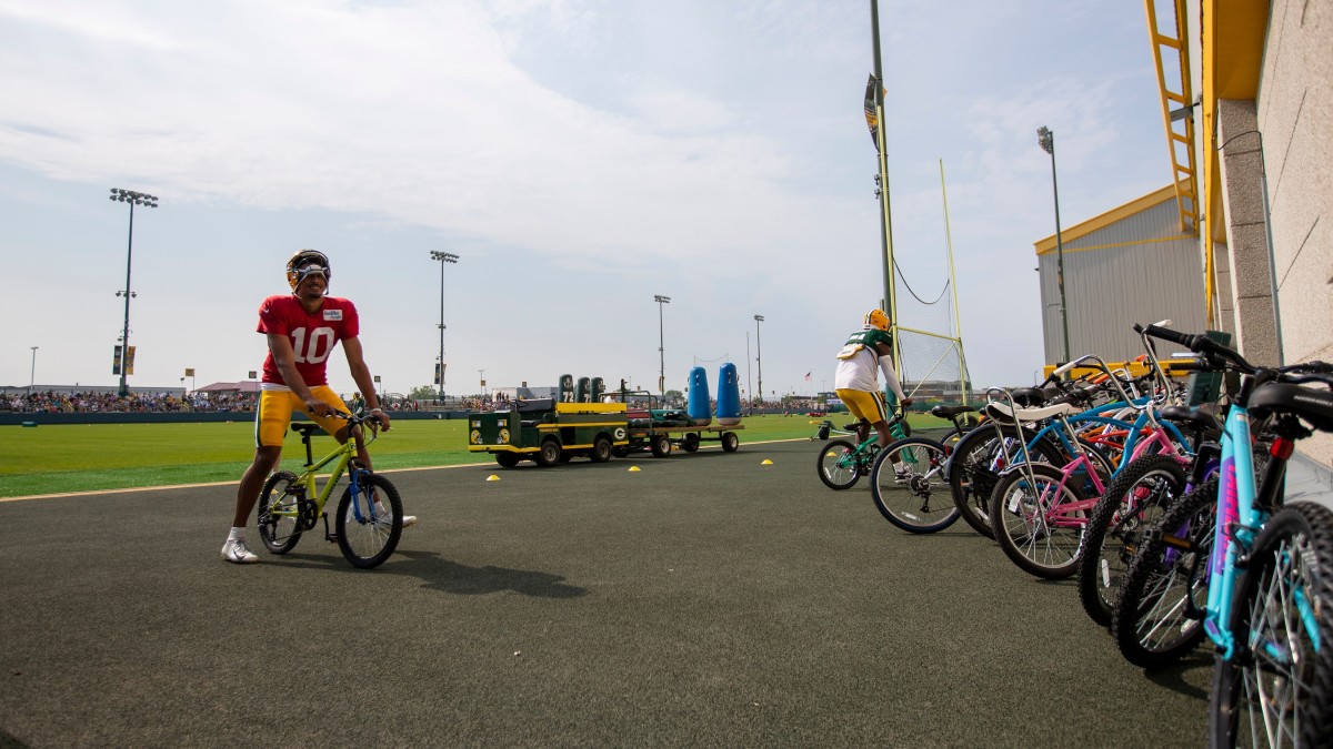 J.J. Watt participates in Packers tradition, breaks kid's bike in process