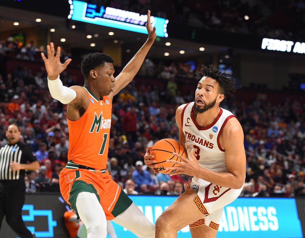 Southern California Trojans forward Isaiah Mobley (3) drives to the basket against Miami Hurricanes forward Anthony Walker (1) during the first round of the 2022 NCAA Tournament at Bon Secours Wellness Arena.