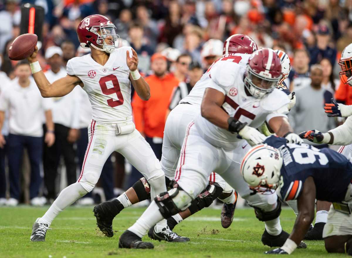 Bryce Young drops back to pass during the first half against Auburn.