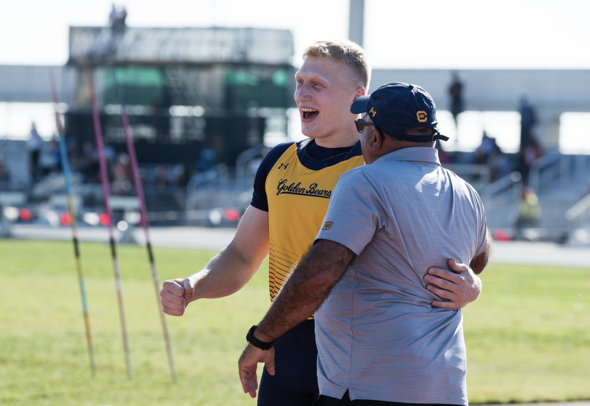 Myoklas Alekna celebrates with Cal throws coach Mo Saatara