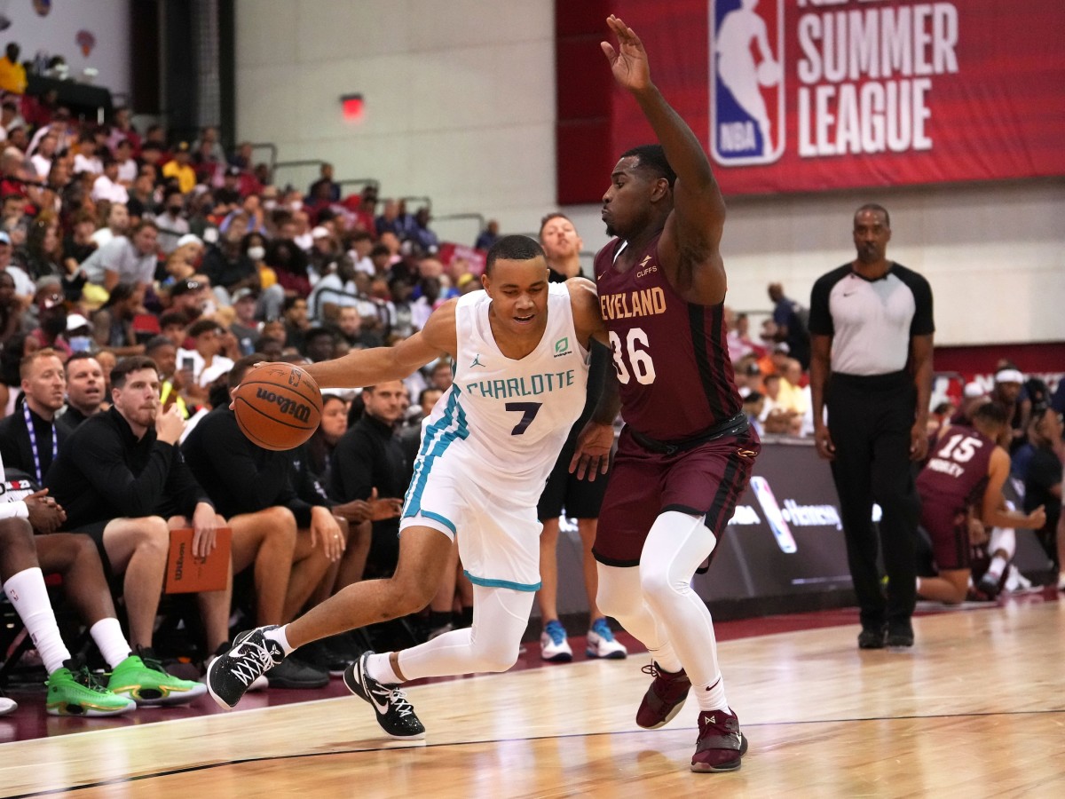 Cleveland Cavaliers Ochai Agbaji (30) dribbles the ball past Charlotte  Hornets Bryce McGowens ( …