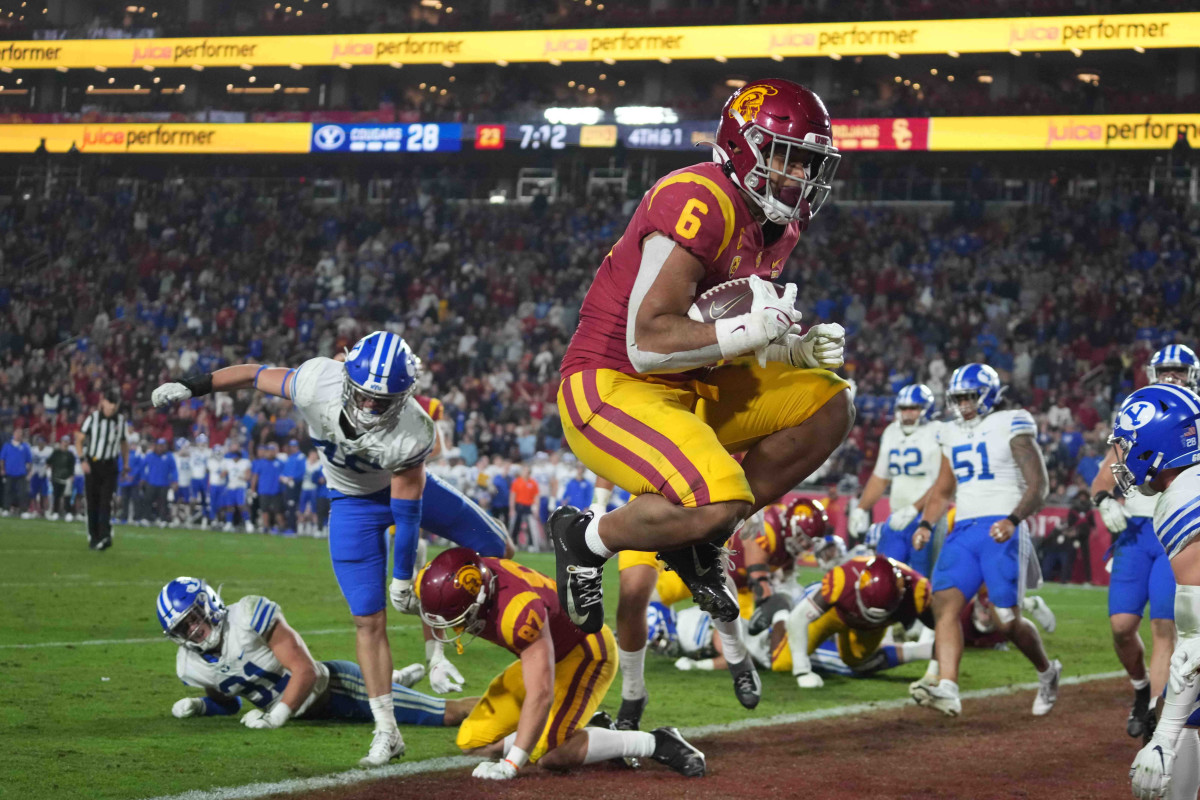 Los Angeles, California, USA; Southern California Trojans running back Vavae Malepeai (6) scores a touchdown against the BYU Cougars in the second half at United Airlines Field at Los Angeles Memorial Coliseum.