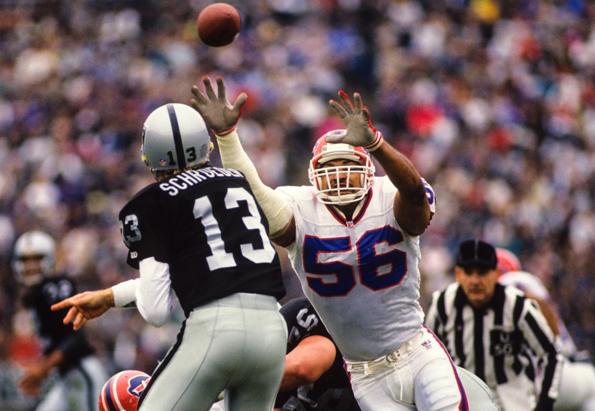 Former Oakland Raider Jay Schroeder signs a football for a fan at Linq  Hotel and Casino on Mond …