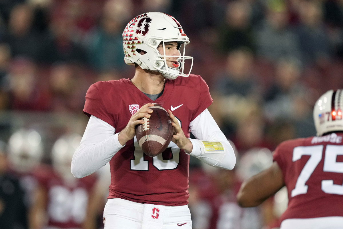 Stanford Cardinal quarterback Tanner McKee (18) drops back to pass during the first quarter against the Notre Dame Fighting Irish at Stanford Stadium. Mandatory Credit: Darren Yamashita-USA TODAY Sports.