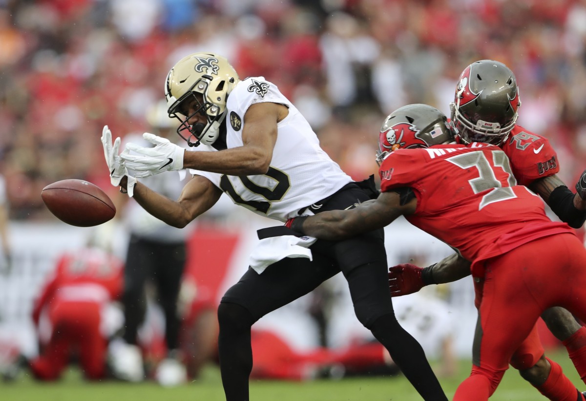 Buccaneers safety Jordan Whitehead (31) knocks the ball away from Saints receiver Tre'Quan Smith (10). Mandatory Credit: Kevin Jairaj-USA TODAY Sports