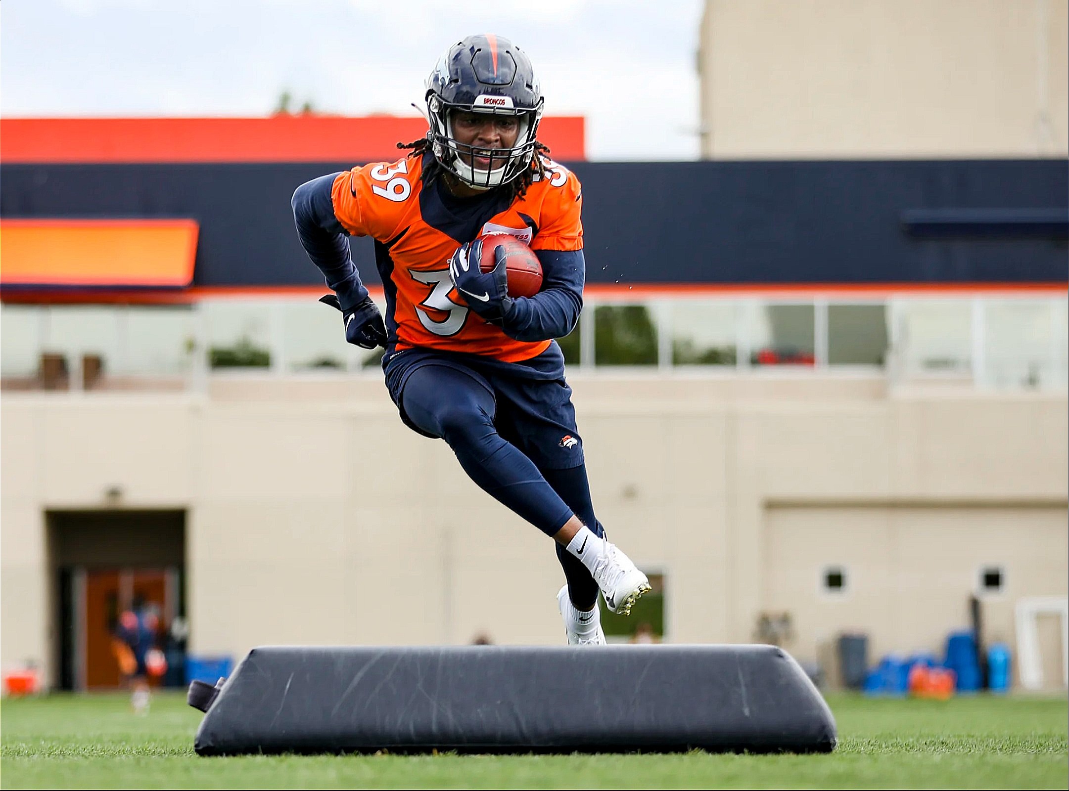 Denver Broncos running back Tyreik McAllister takes part in drills during a  rookie mini camp NFL football session Friday, May 13, 2022, at the team's  headquarters in Centennial, Colo. (AP Photo/David Zalubowski