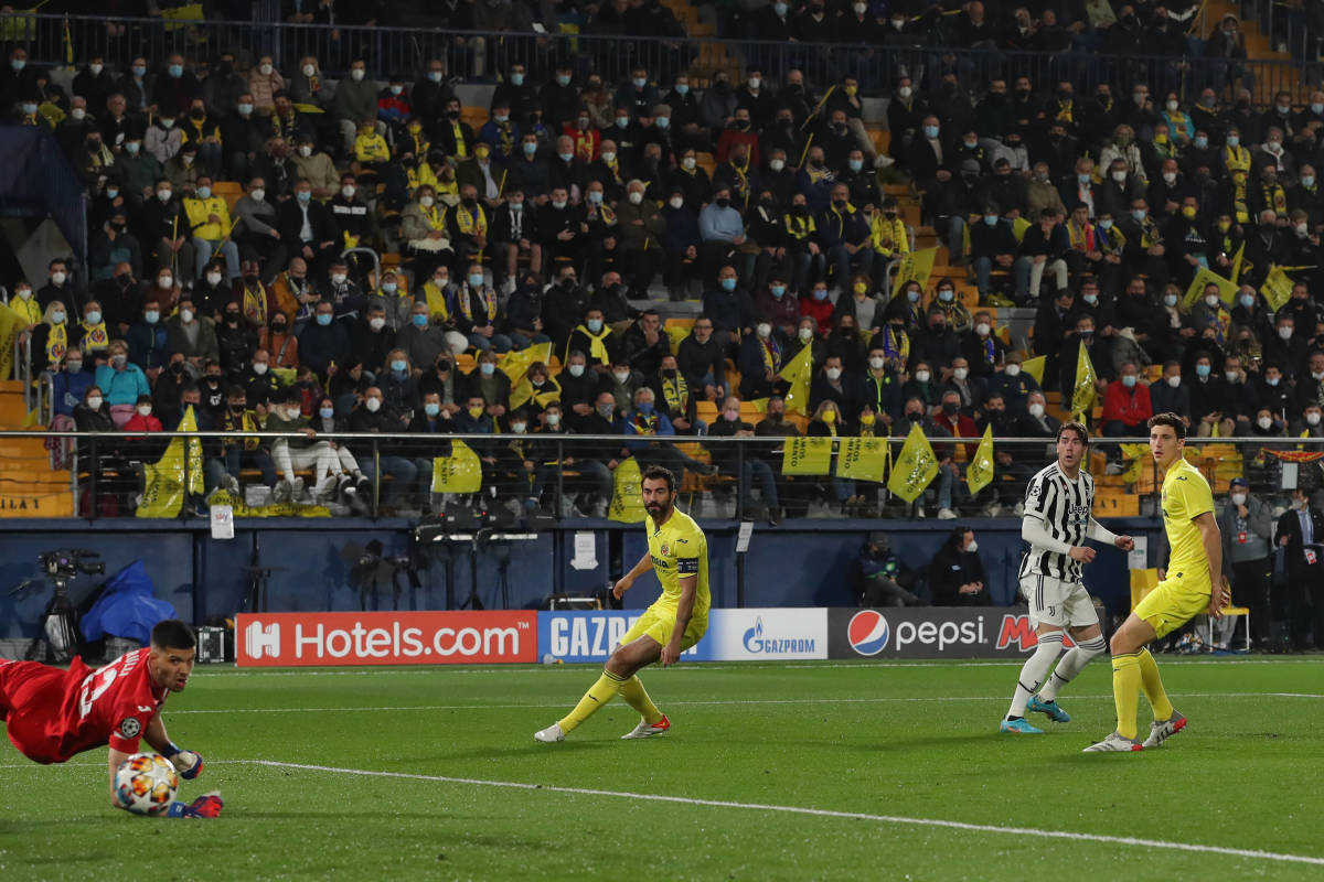 Dusan Vlahovic watches on as his shot beats Geronimo Rulli to give him his first ever Champions League goal for Juventus