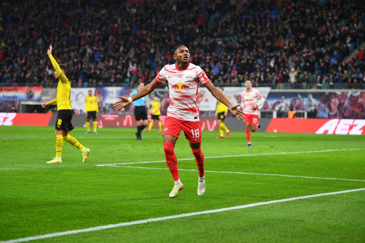 Christopher Nkunku celebrates scoring for RB Leipzig against Borussia Dortmund in November 2021