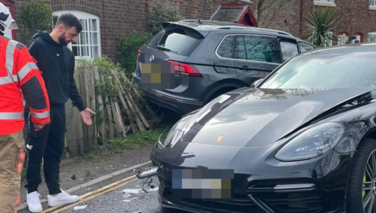 Bruno Fernandes pictured next to his Porsche after being involved in a car crash