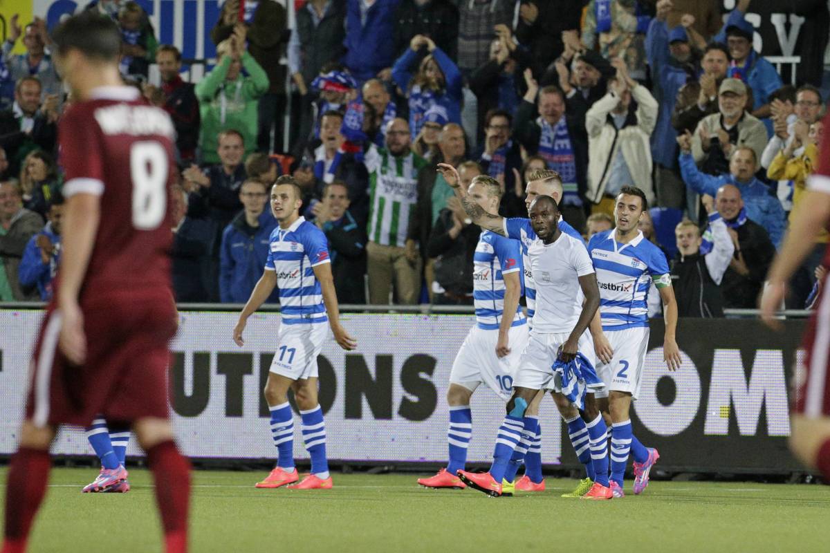 Jody Lukoki pictured in a white vest after removing his shirt while celebrating scoring PEC Zwolle's first ever European goal in 2014