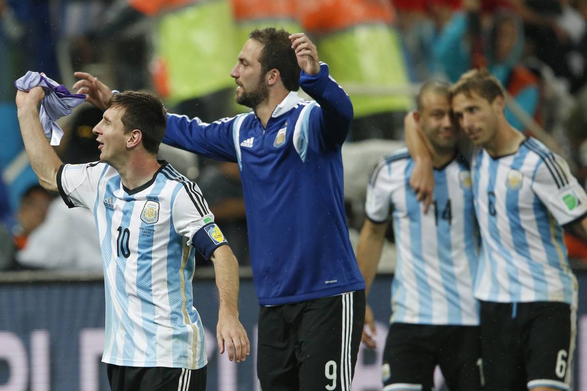 Lionel Messi (left) pictured celebrating with Gonzalo Higuain after Argentina beat Holland to reach the 2014 World Cup final