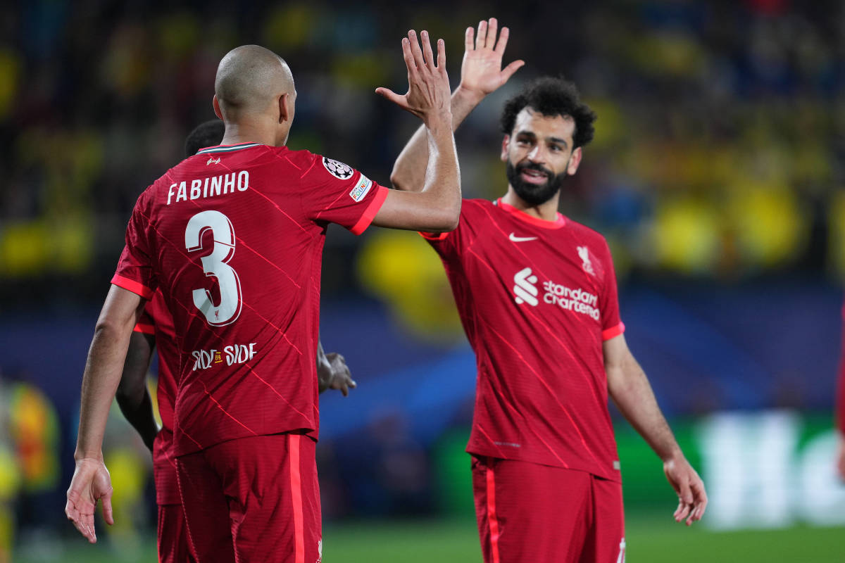 Mo Salah (right) gives Fabinho a high five after assisting the Brazilian for a goal in Liverpool's 3-2 win over Villarreal in May 2022