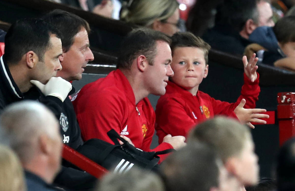 Wayne Rooney (center) pictured at Old Trafford with son Kai (right) in 2016