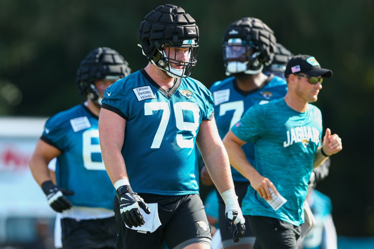 From left, Jacksonville Jaguars' Luke Fortner (79), Tyler Shatley (69), and  offensive tackle Walker Little (72) in action during an NFL football game  against the Tennessee Titans, Saturday, Jan. 7, 2023, in