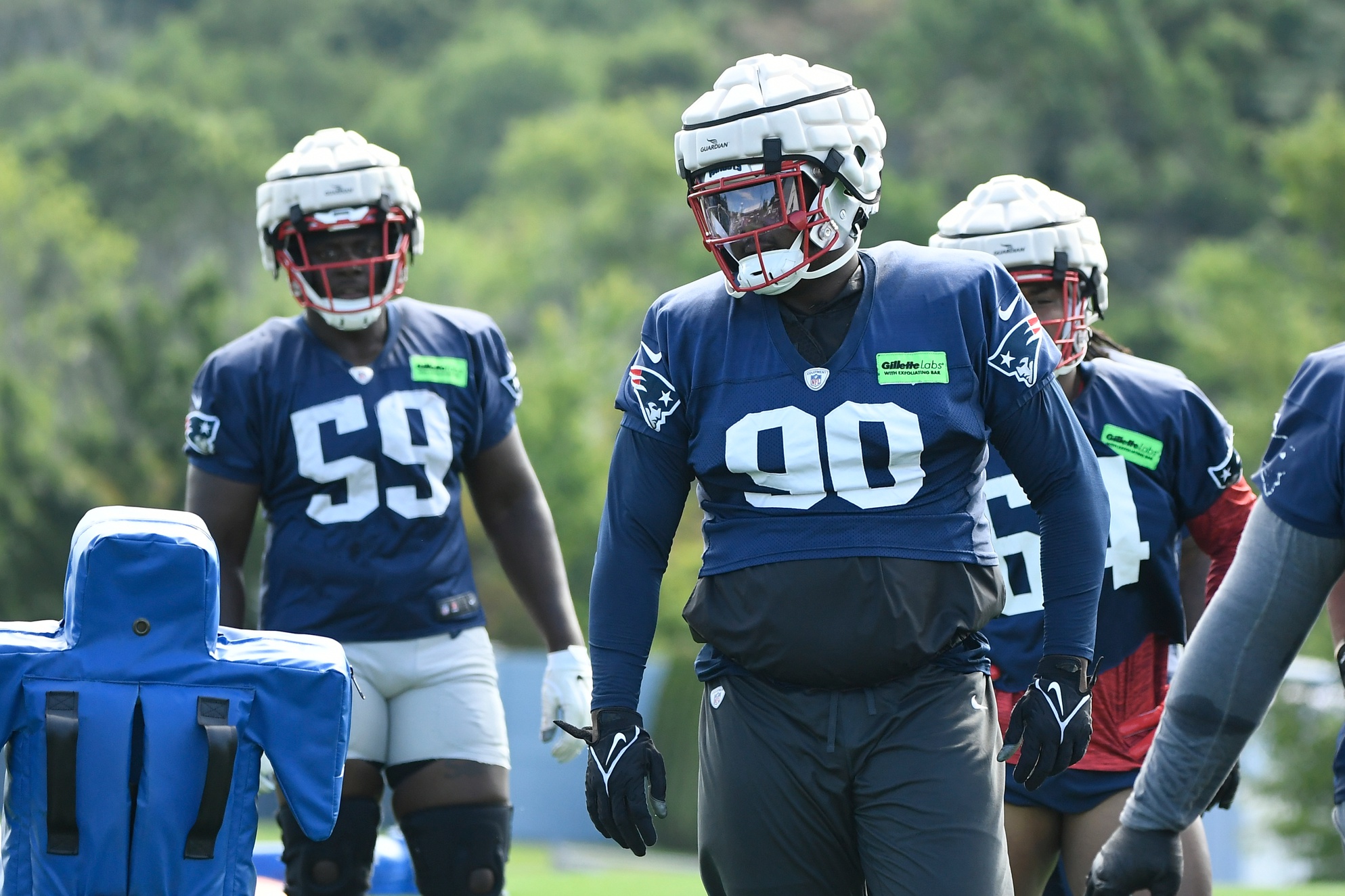 Patriots, rest of NFL wearing cushioned helmet caps at training camp, per  new mandate - CBS Boston