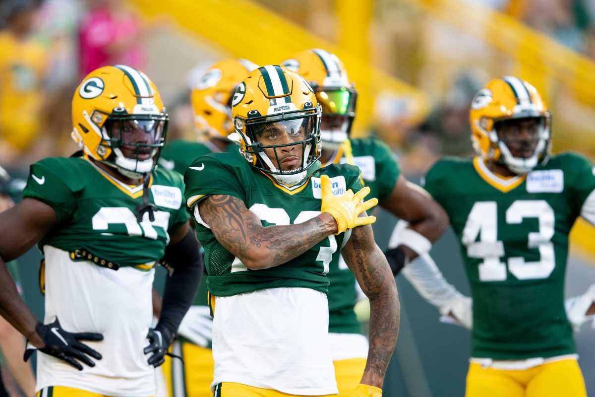 Green Bay Packers' Jack Coco rides a bike to NFL football training