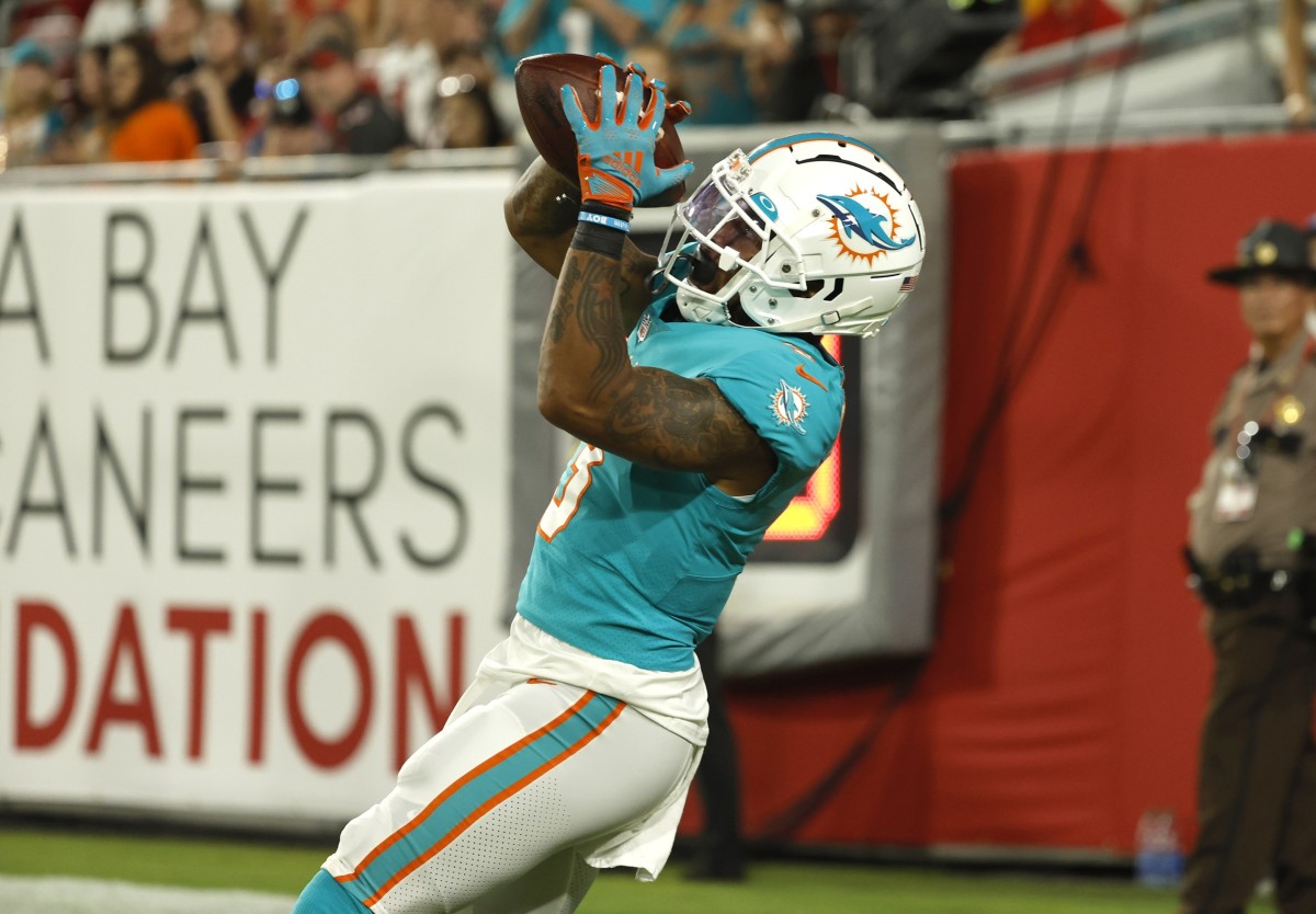 Miami Dolphins players celebrate after wide receiver Lynn Bowden Jr. (3)  scored a 22-yard touchdown on a pass play during the first half of a  preseason NFL football game against the Tampa