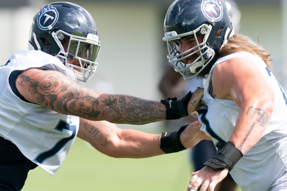 Tennessee Titans offensive tackle Taylor Lewan (77) blocks guard Jordan Roos (70) during practice at Saint Thomas Sports Park Tuesday, June 14, 2022, in Nashville, Tenn. Nas Titans Mini Camp 026