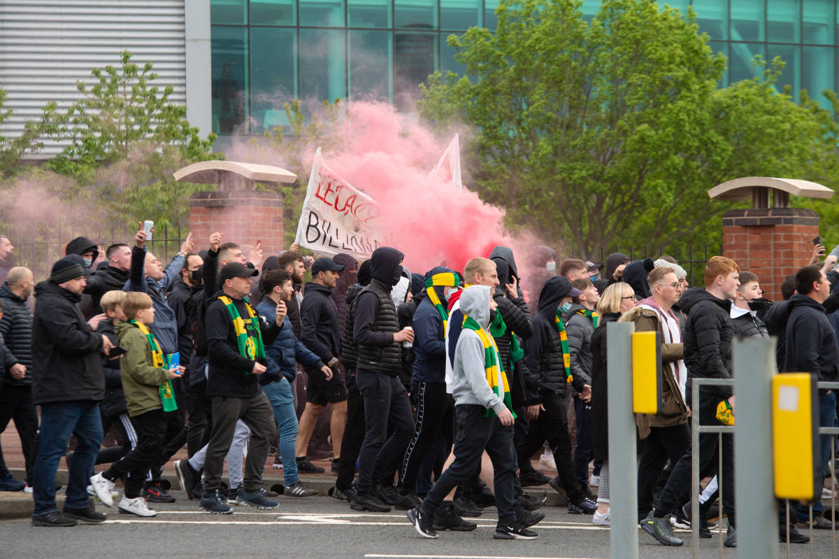 Manchester United fans pictured protesting against the club's American owners outside Old Trafford in May 2021