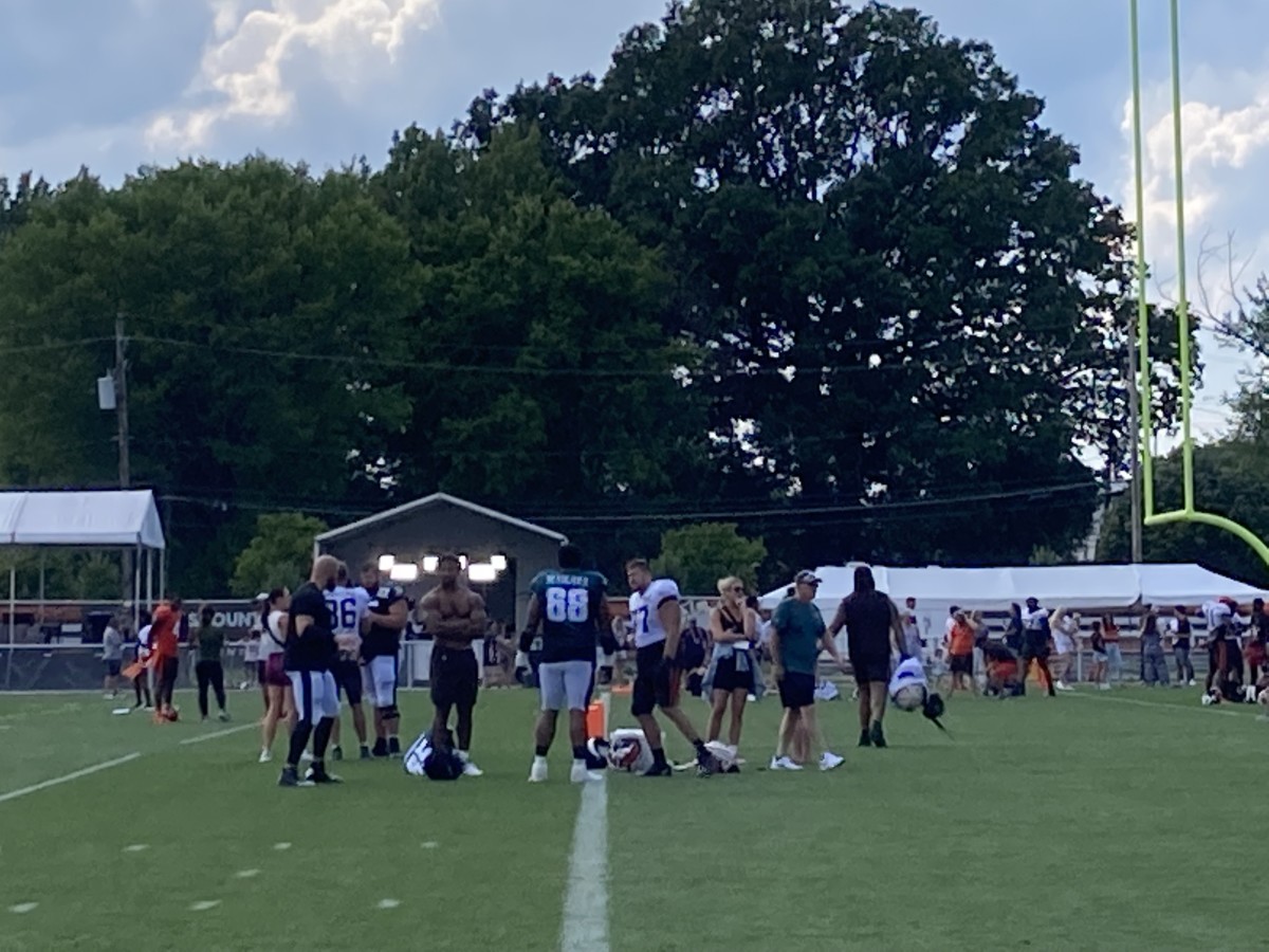 Jordan Mailata (68), Lane Johnson (to left of Mailata), Myles Garrett (shirtless), and Wyatt Teller (to Mailata's right) meet up following Friday's practice