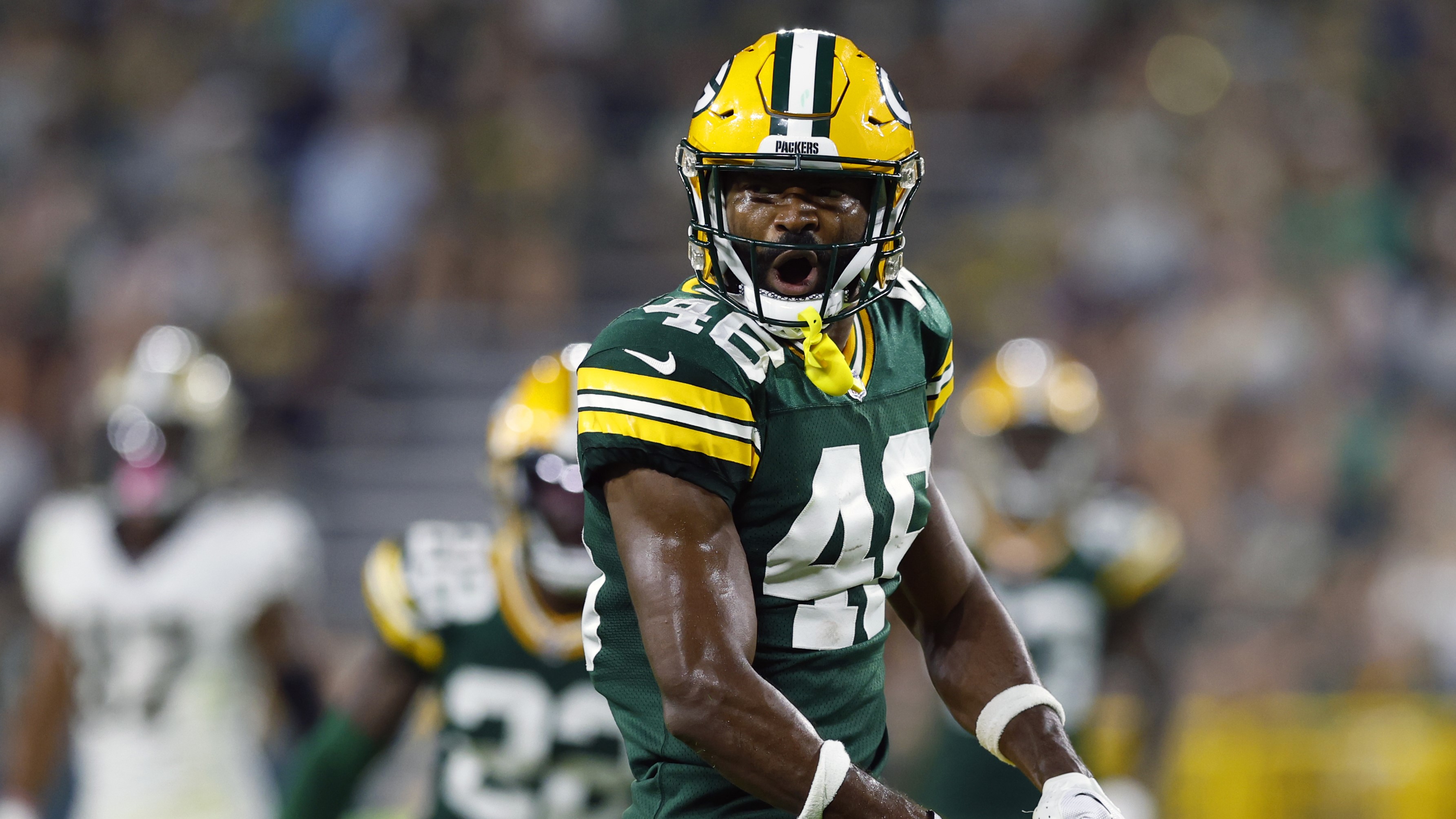 Green Bay Packers safety Micah Abernathy (46) and linebacker Isaiah  McDuffie (58) celebrate an interception against the New Orleans Saints  during a preseason NFL football game Friday, Aug. 19, 2022, in Green