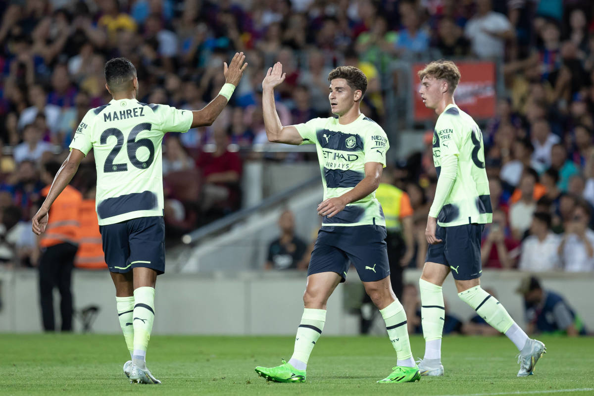 Manchester City goal scorers Riyad Mahrez (left), Julian Alvarez (center) and Cole Palmer (right) pictured during their team's 3-3 draw with Barcelona in August 2022