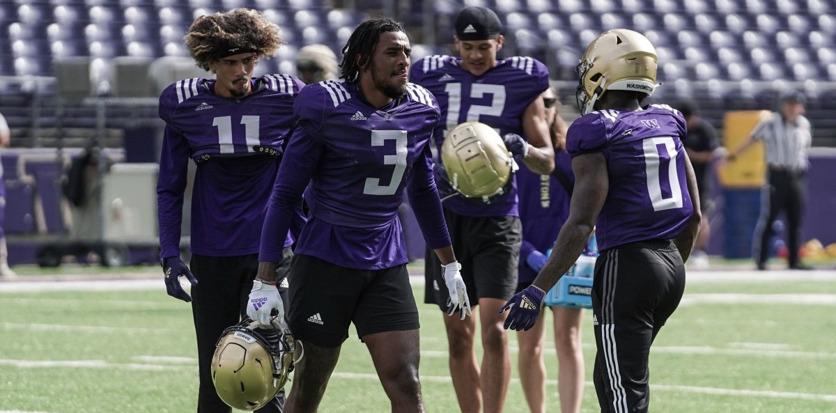 Jalen McMillan (11), Taj Davis (3), Denzel Boston (12) and Giles Jackson (0) all stand to benefit from a more wide-open UW offense that has a few gimmicks.