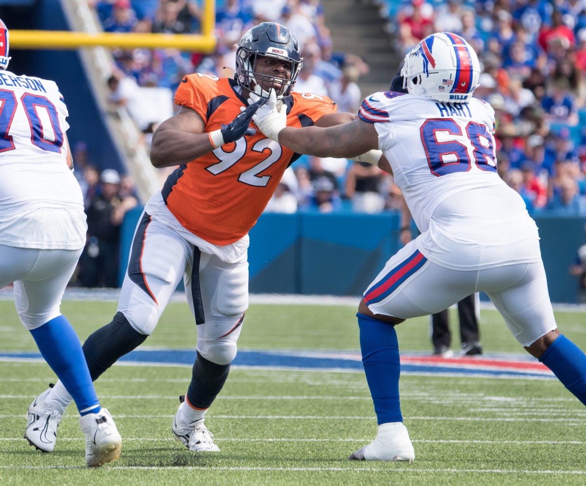 Denver Broncos defensive tackle Jonathan Harris (92) with Buffalo Bills tackle Bobby Hart (68) in the third quarter of a pre-season game at Highmark Stadium.