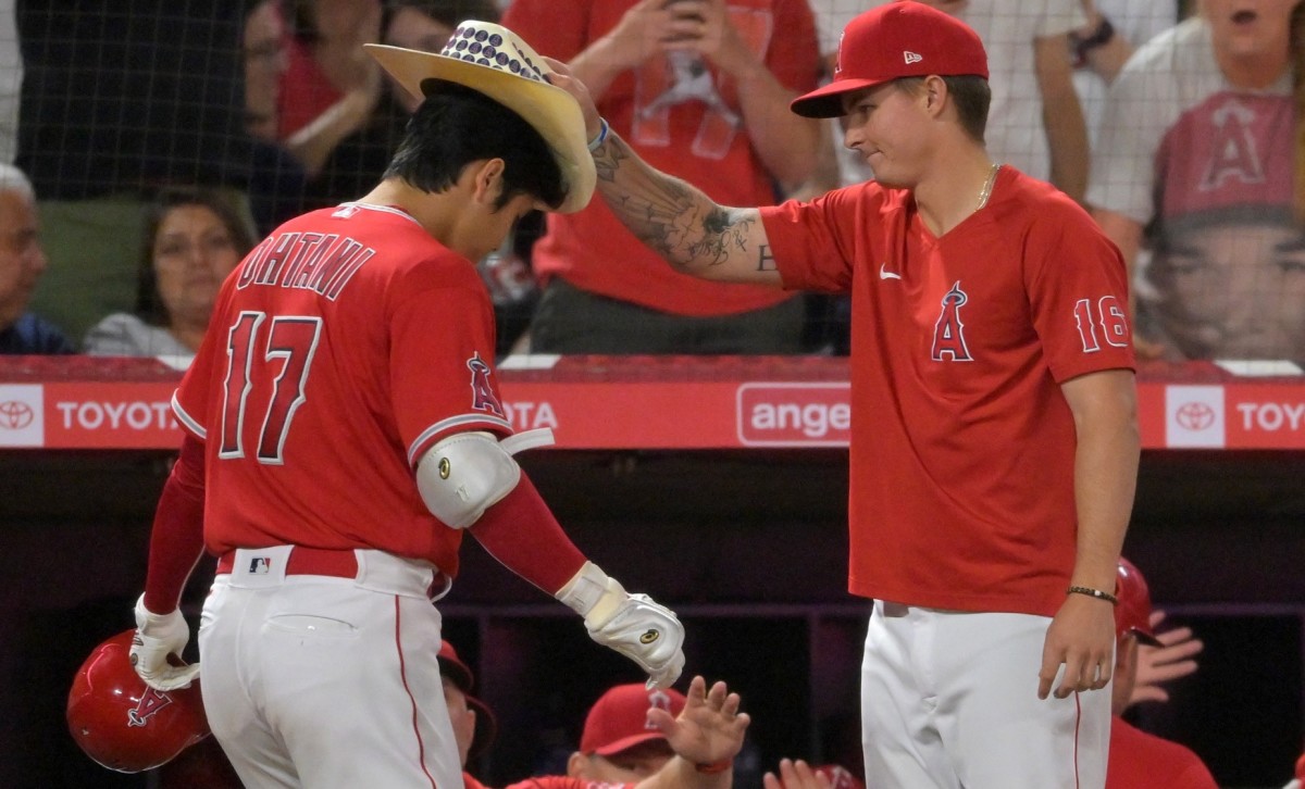 Los Angeles Angels designated hitter Shohei Ohtani (17) has the home run cowboy hat placed on his head by Mickey Moniak (16) after hitting a two-run home run in the fifth inning off New York Yankees starting pitcher Frankie Montas (not pictured) at Angel Stadium. (Jayne Kamin-Oncea-USA TODAY Sports)