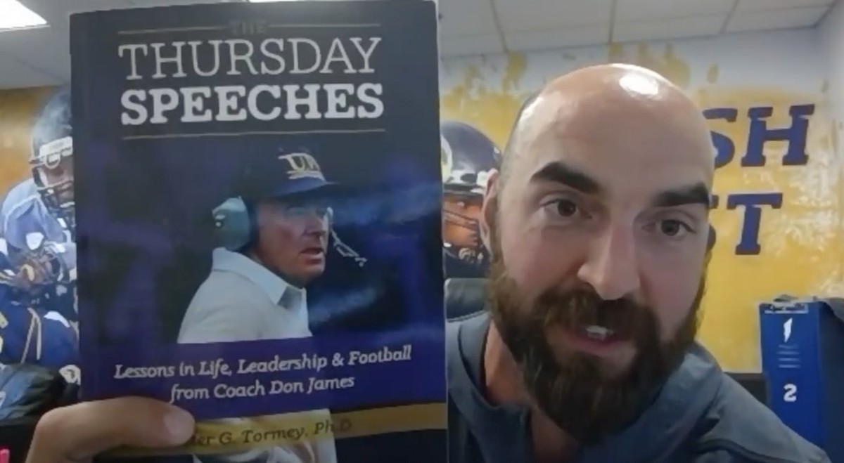 Kent State coach Sean Lewis keeps a Don James book on his office desk.