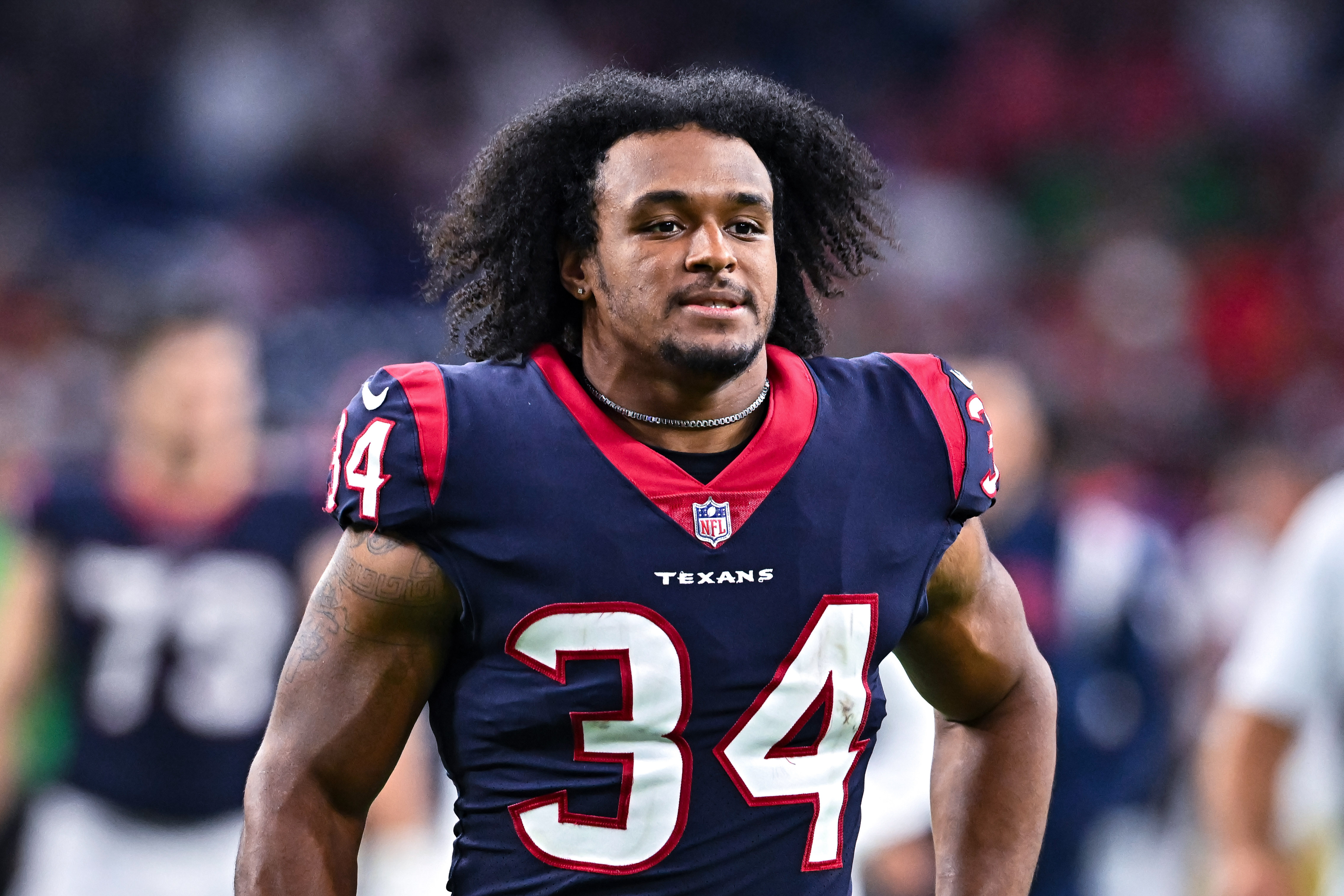 Houston Texans defensive end Troy Hairston (34) warms up against