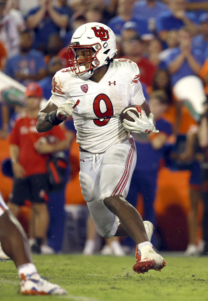 Utah Utes running back Tavion Thomas (9) runs with the ball against the Florida Gators during the second half at Steve Spurrier-Florida Field.