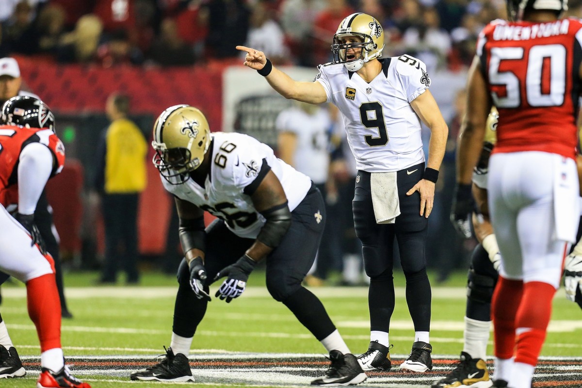 Nov 21, 2013; New Orleans Saints quarterback Drew Brees (9) makes a call at the line of scrimmage in the first quarter against the Atlanta Falcons. Mandatory Credit: Daniel Shirey-USA TODAY Sports