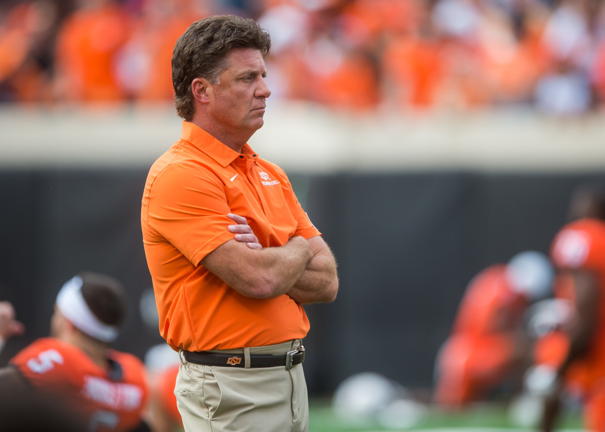 Oklahoma State Cowboys head coach Mike Gundy looks on during warmups before the game against Central Michigan Chippewas at Boone Pickens Stadium.