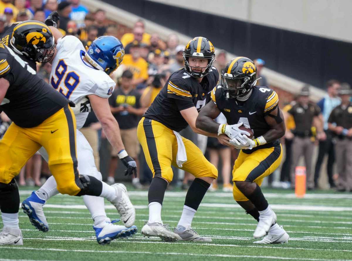 Iowa quarterback Spencer Petras hands the ball off to running back Leshon Williams in the second quarter against South Dakota State during a NCAA football game on Saturday, Sept. 3, 2022, at Kinnick Stadium in Iowa City.