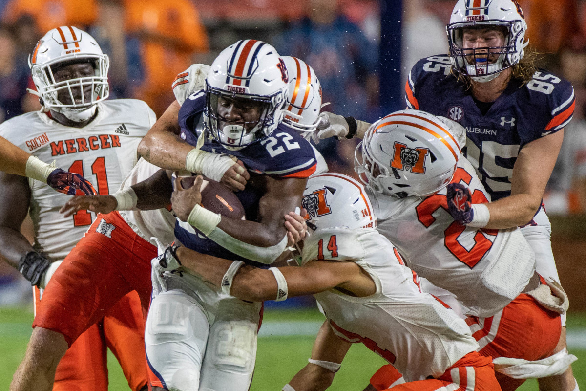 Damari Alston carries the ball against the Mercer defense.