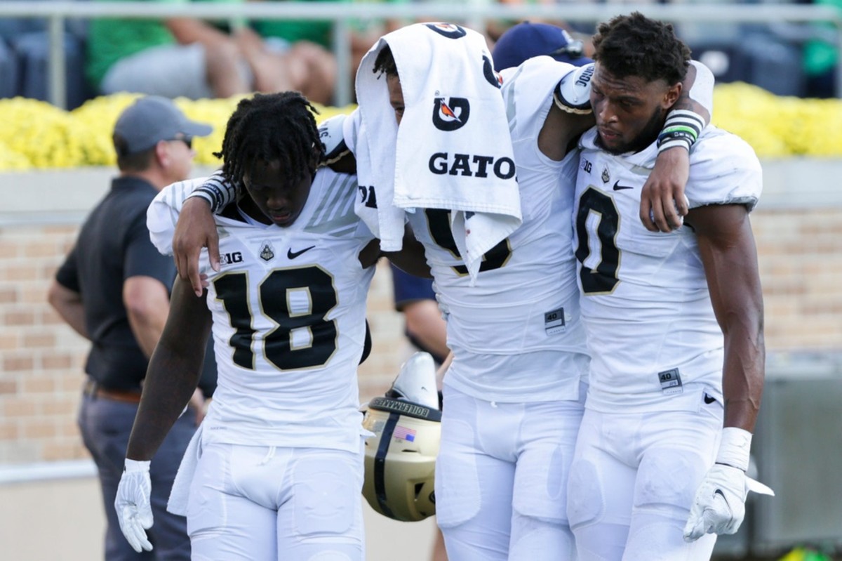 Purdue wide receiver Mershawn Rice (9) is helped off the field by Purdue wide receiver Deion Burks (18) and Purdue wide receiver Milton Wright (0) during the fourth quarter of an NCAA football game, Saturday, Sept. 18, 2021, at Notre Dame Stadium in South Bend.