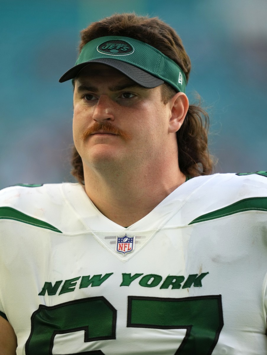 New York Jets guard Dan Feeney (67) leaves the field after the game against the Miami Dolphins at Hard Rock Stadium.