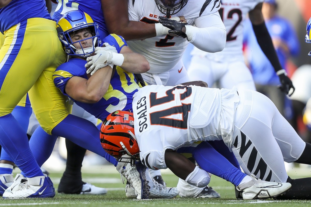 Cincinnati Bengals linebacker Tegray Scales (45) tackles Los Angeles Rams running back Jake Funk (34) in the first half at Paycor Stadium.