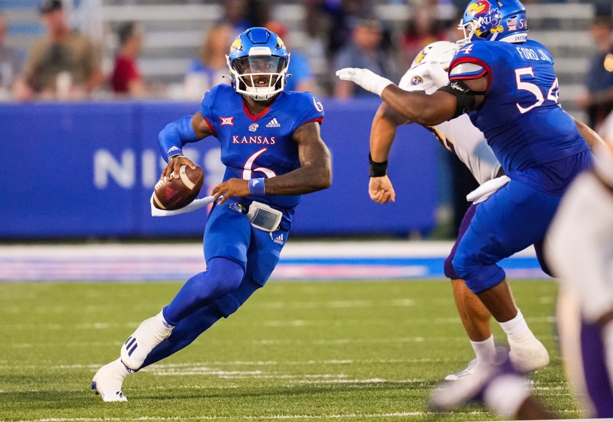 Sep 2, 2022; Lawrence, Kansas, USA; Kansas Jayhawks quarterback Jalon Daniels (6) rolls out to pass against the Tennessee Tech Golden Eagles during the first half at David Booth Kansas Memorial Stadium.