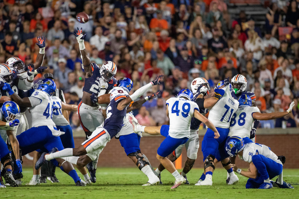 The Auburn defense puts the pressure on the left side forcing San Jose State to kick wide right during the San Jose vs Auburn game on September 10, 2022.