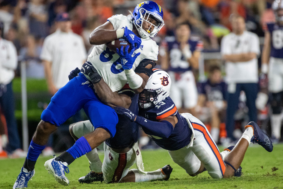 Auburn Tigers linebacker Owen Pappoe (0) and linebacker Cam Riley (13) combine for the tackle in the backfield during the San Jose State vs Auburn game on Saturday, Sept. 10, 2022.