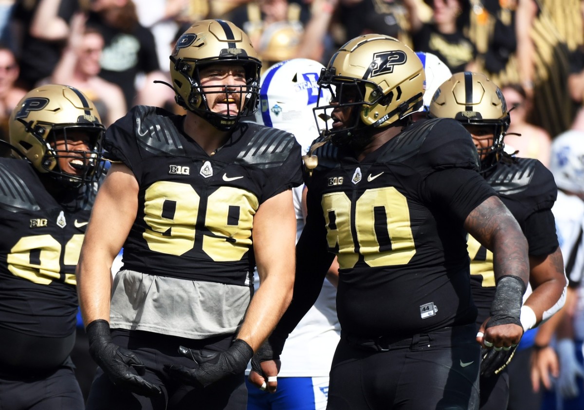 Sep 10, 2022; West Lafayette, Indiana, USA; Purdue Boilermakers defensive end Jack Sullivan (99) and Purdue Boilermakers defensive tackle Lawrence Johnson (90) celebrate after a sack during the first quarter against the Indiana State Sycamores at Ross-Ade Stadium.