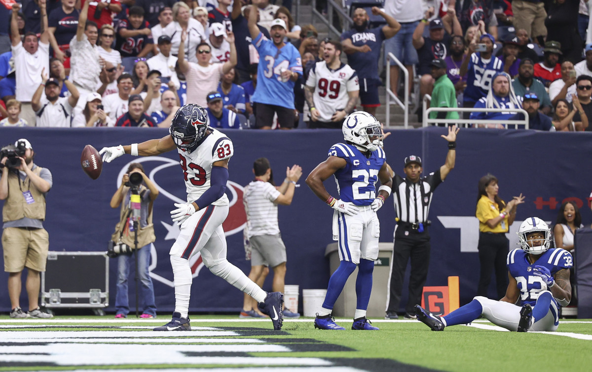 Sep 11, 2022; Houston, Texas, USA; Indianapolis Colts cornerback Kenny Moore II (23) reacts and Houston Texans tight end O.J. Howard (83) celebrates after scoring on a touchdown reception during the second quarter at NRG Stadium.