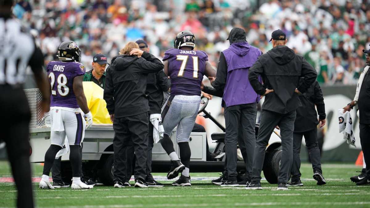 Baltimore Ravens offensive tackle Ronnie Stanley (79) and John Harbaugh  takes the field to face the New York Giants during an NFL football game  Sunday, Oct. 16, 2022, in East Rutherford, N.J. (