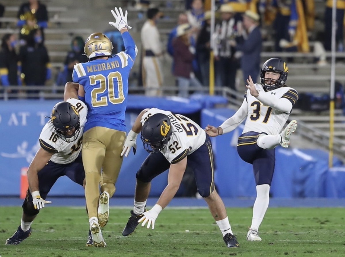 Jamieson Sheahan punts against UCLA last season.