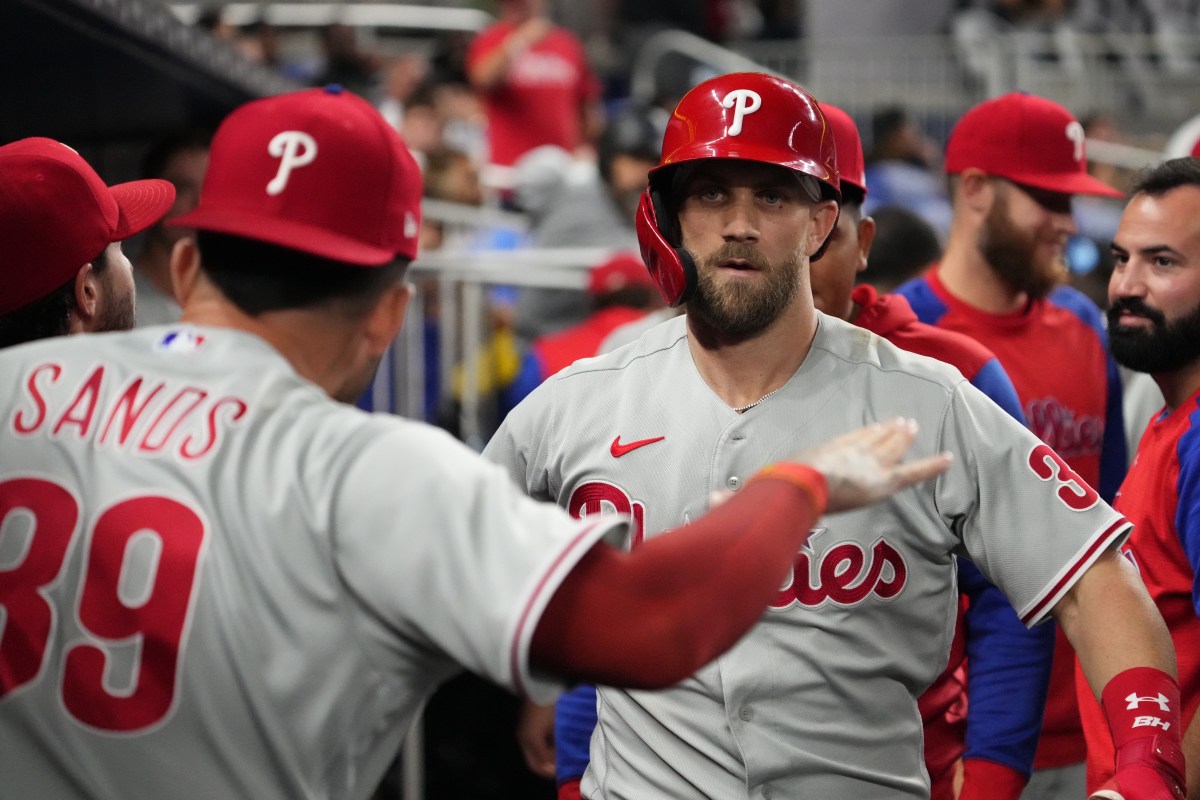 Bryce Harper celebrates a solo home run with his teammates.